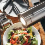 Automatic salt and pepper grinders